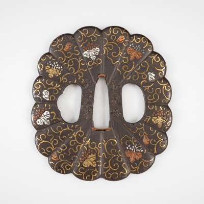 Lot 558 - KOIKE NAOMASA: AN IRON TSUBA WITH KIRI AND KARAKUSA