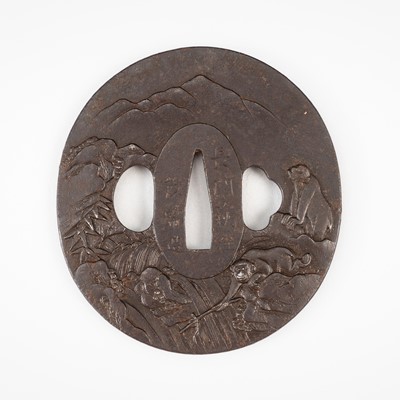 Lot 556 - SHIGETSUNE: A FINE IRON TSUBA WITH MONKEYS AND WATERFALL