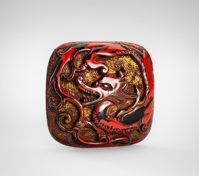 Lot 1737 - A NEGORO LACQUER MANJU NETSUKE WITH A RAIN DRAGON