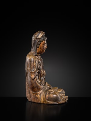 Lot 63 - A GILT-LACQUERED WOOD FIGURE OF GUANYIN, MING DYNASTY