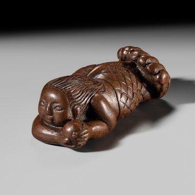 SHIKO: A RARE AND LARGE WOOD NETSUKE OF A NINGYO WITH TAMA