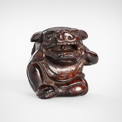 Lot 1616 - MIWA: A FINE PLUM (ISU) WOOD NETSUKE OF A BOY WITH A SHISHIMAI MASK