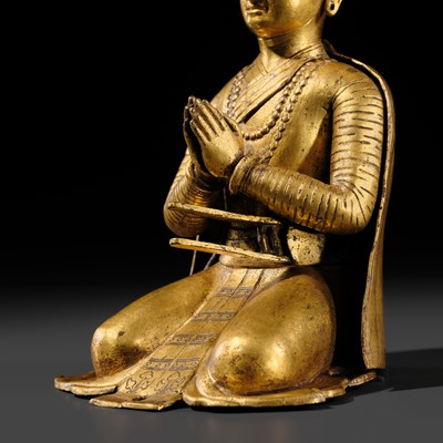 Lot 27 - AN IMPORTANT GILT COPPER ALLOY FIGURE OF A ROYAL DONOR, NEPAL, 17TH-18TH CENTURY