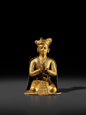 Lot 27 - AN IMPORTANT GILT COPPER ALLOY FIGURE OF A ROYAL DONOR, NEPAL, 17TH-18TH CENTURY