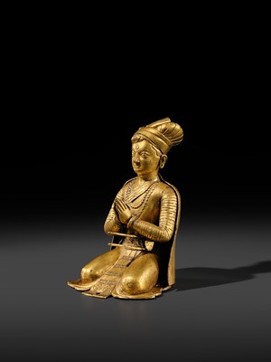 Lot 27 - AN IMPORTANT GILT COPPER ALLOY FIGURE OF A ROYAL DONOR, NEPAL, 17TH-18TH CENTURY