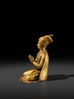Lot 27 - AN IMPORTANT GILT COPPER ALLOY FIGURE OF A ROYAL DONOR, NEPAL, 17TH-18TH CENTURY