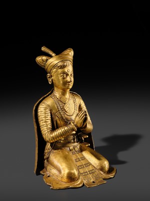 Lot 27 - AN IMPORTANT GILT COPPER ALLOY FIGURE OF A ROYAL DONOR, NEPAL, 17TH-18TH CENTURY