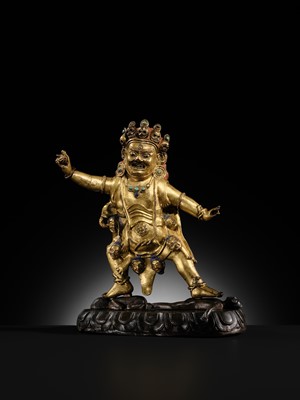 Lot 21 - A GILT-BRONZE FIGURE OF NILAMBARA VAJRAPANI, TIBET, 16TH-17TH CENTURY