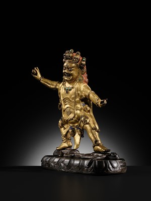 Lot 21 - A GILT-BRONZE FIGURE OF NILAMBARA VAJRAPANI, TIBET, 16TH-17TH CENTURY