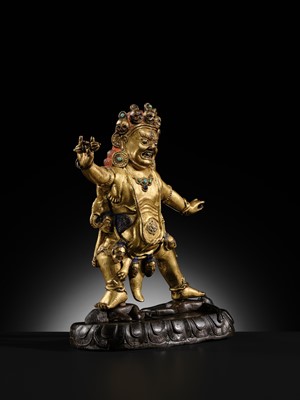 Lot 21 - A GILT-BRONZE FIGURE OF NILAMBARA VAJRAPANI, TIBET, 16TH-17TH CENTURY