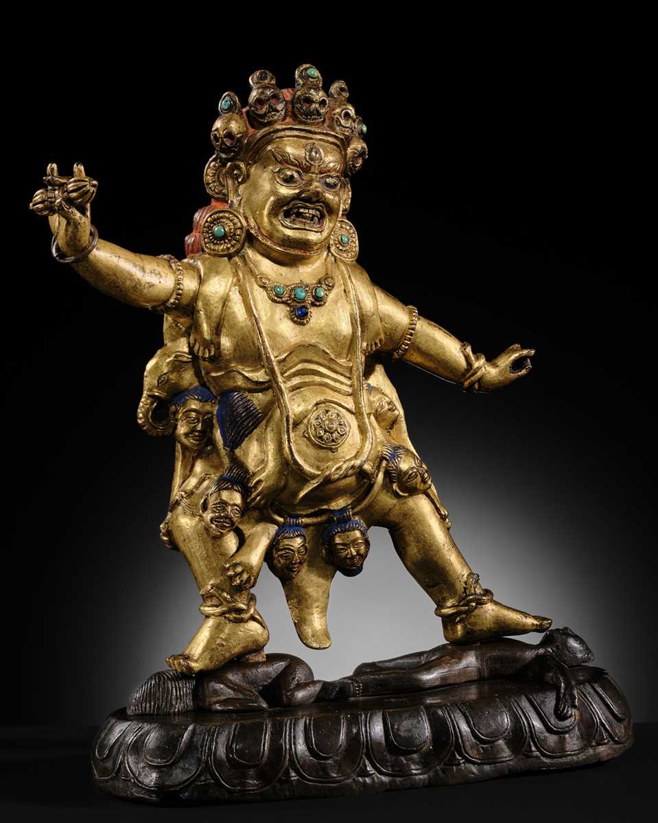 Lot 21 - A GILT-BRONZE FIGURE OF NILAMBARA VAJRAPANI, TIBET, 16TH-17TH CENTURY