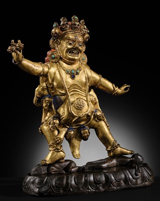 Lot 21 - A GILT-BRONZE FIGURE OF NILAMBARA VAJRAPANI, TIBET, 16TH-17TH CENTURY