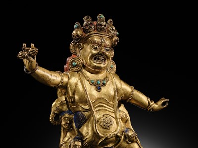 Lot 21 - A GILT-BRONZE FIGURE OF NILAMBARA VAJRAPANI, TIBET, 16TH-17TH CENTURY