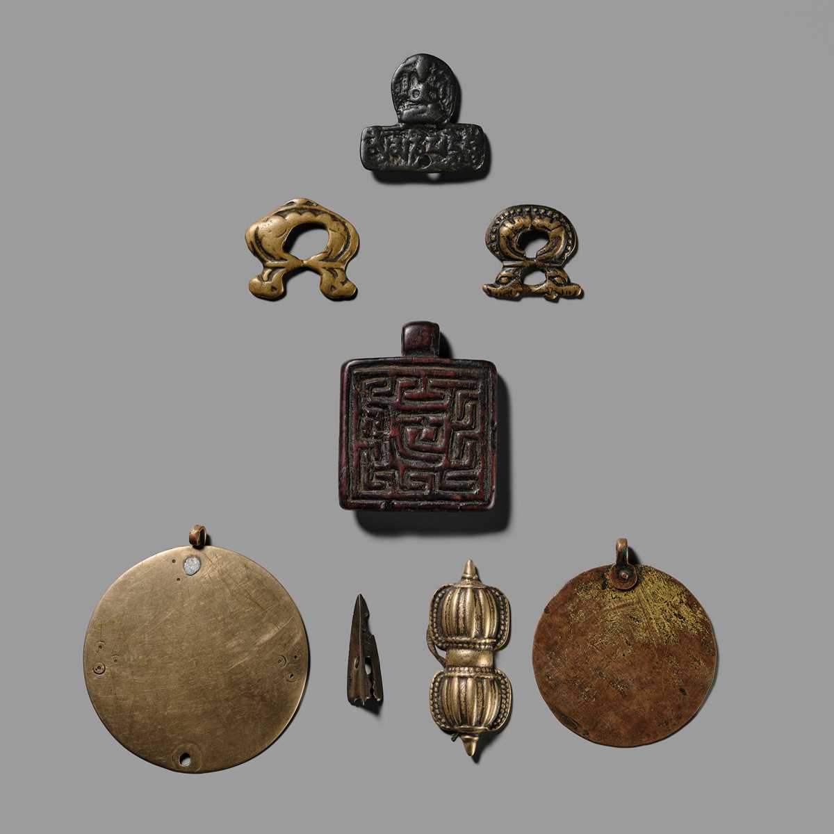 Lot 1 - A GROUP OF THOGCHAGS, MELONG, AND PENDANTS, 12TH-15TH CENTURY