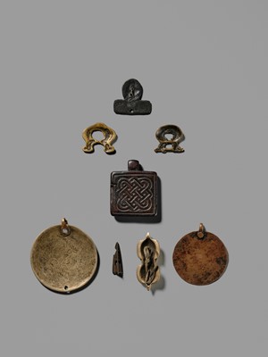 Lot 1 - A GROUP OF THOGCHAGS, MELONG, AND PENDANTS, 12TH-15TH CENTURY