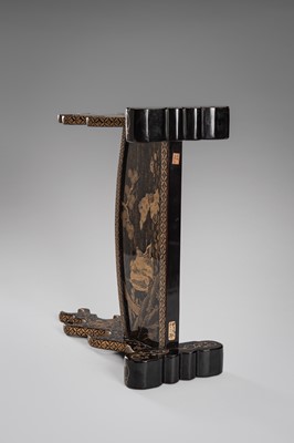 Lot 520 - A FINE BLACK AND GOLD LACQUER KATANE-KAKE (SWORD STAND)