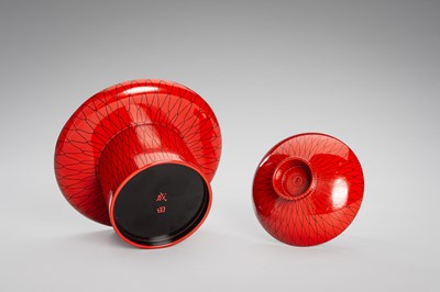 Lot 139 - SEIHO: A SMALL LACQUER SAKE CUP (SAKAZUKI), STAND WITH A KOI AND A TOMOBAKO (STORAGE BOX)
