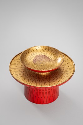 Lot 139 - SEIHO: A SMALL LACQUER SAKE CUP (SAKAZUKI), STAND WITH A KOI AND A TOMOBAKO (STORAGE BOX)