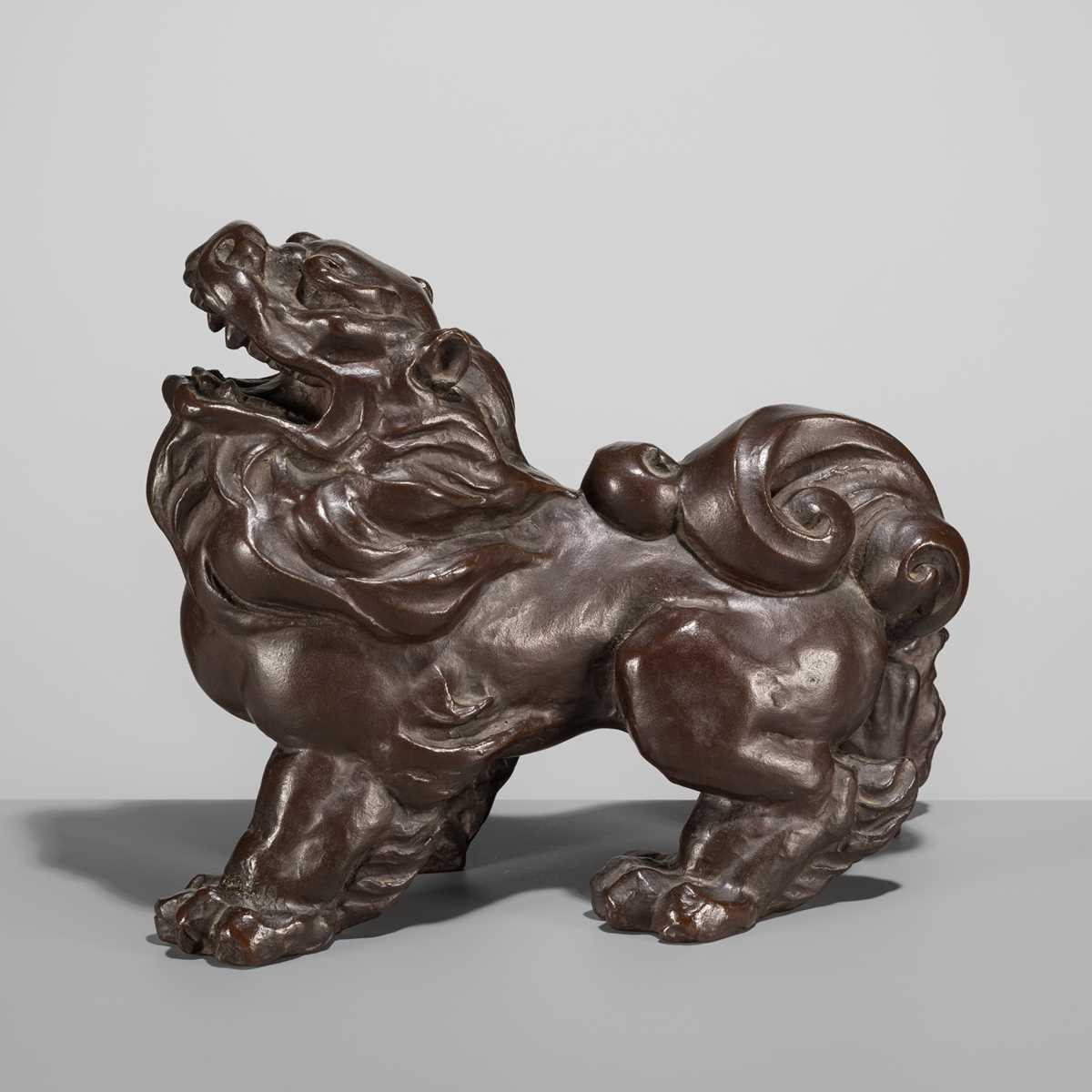 Lot 42 - SUKENOJO TERAHATA: A BRONZE OKIMONO OF A ROARING SHISHI