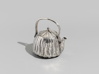 Lot 30 - JOMI EISUKE II: A RARE AND FINE SILVER LOTUS POD-FORM TEAPOT