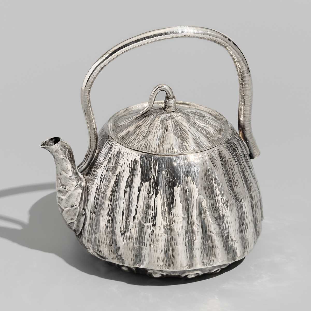 Lot 30 - JOMI EISUKE II: A RARE AND FINE SILVER LOTUS POD-FORM TEAPOT