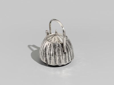 Lot 30 - JOMI EISUKE II: A RARE AND FINE SILVER LOTUS POD-FORM TEAPOT