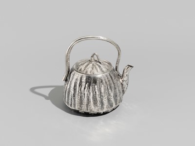 Lot 30 - JOMI EISUKE II: A RARE AND FINE SILVER LOTUS POD-FORM TEAPOT