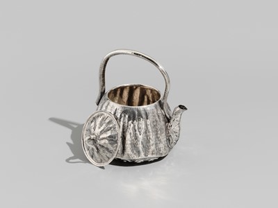 Lot 30 - JOMI EISUKE II: A RARE AND FINE SILVER LOTUS POD-FORM TEAPOT