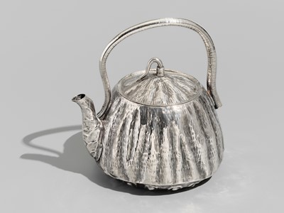 Lot 30 - JOMI EISUKE II: A RARE AND FINE SILVER LOTUS POD-FORM TEAPOT