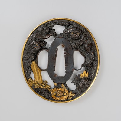 Lot 563 - A FINE SHAKUDO SUKASHI TSUBA WITH SHISHI AND PEONY FLOWERS