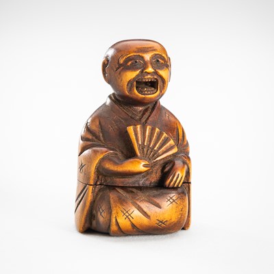 Lot 1798 - AN SHUNGA KARAKURI (TRICK) WOOD NETSUKE OF A RAKUGOKA