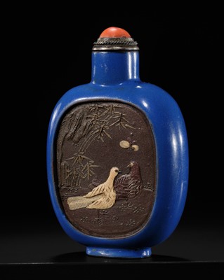 A SLIP-DECORATED AND ENAMELED ‘DOVES AND PEKINGESE DOG’ SNUFF BOTTLE, YIXING, 1820-1850