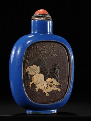 A SLIP-DECORATED AND ENAMELED ‘DOVES AND PEKINGESE DOG’ SNUFF BOTTLE, YIXING, 1820-1850