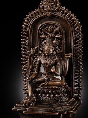 Lot 214 - AN IMPORTANT AND PUBLISHED COPPER ALLOY SHRINE OF SHIVA, ORISSA, 11TH CENTURY