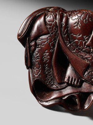 Lot 128 - SHUOSAI HIDEMASA: A FINE WOOD NETSUKE OF OKAME