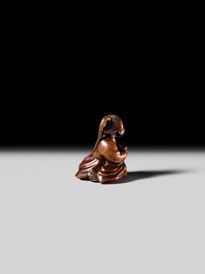 Lot 128 - SHUOSAI HIDEMASA: A FINE WOOD NETSUKE OF OKAME