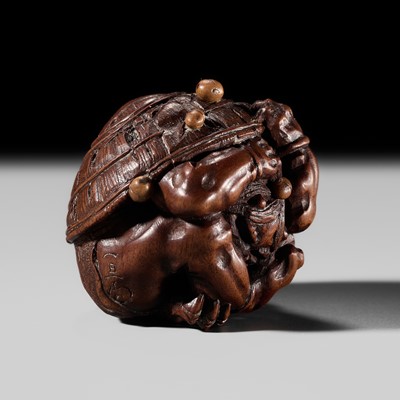 Lot 467 - ITTAN: A SUPERB WOOD NETSUKE OF A COWERING ONI DURING SETSUBUN
