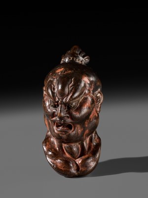 Lot 297 - A LARGE AND SUPERB LACQUERED AND CARVED HINOKI WOOD NETSUKE OF A NIO HEAD, ATTRIBUTED TO NAITO KOSEKI