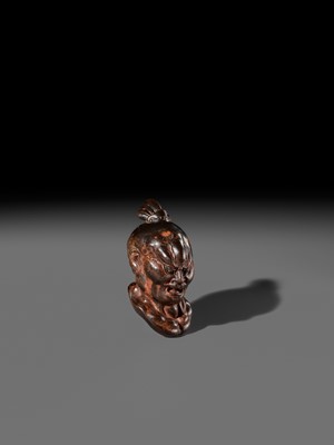 Lot 297 - A LARGE AND SUPERB LACQUERED AND CARVED HINOKI WOOD NETSUKE OF A NIO HEAD, ATTRIBUTED TO NAITO KOSEKI