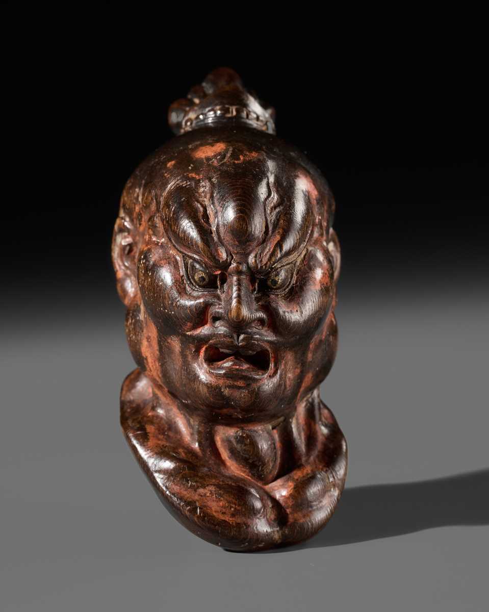 Lot 297 - A LARGE AND SUPERB LACQUERED AND CARVED HINOKI WOOD NETSUKE OF A NIO HEAD, ATTRIBUTED TO NAITO KOSEKI