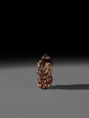 Lot 297 - A LARGE AND SUPERB LACQUERED AND CARVED HINOKI WOOD NETSUKE OF A NIO HEAD, ATTRIBUTED TO NAITO KOSEKI