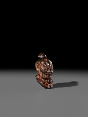 Lot 297 - A LARGE AND SUPERB LACQUERED AND CARVED HINOKI WOOD NETSUKE OF A NIO HEAD, ATTRIBUTED TO NAITO KOSEKI