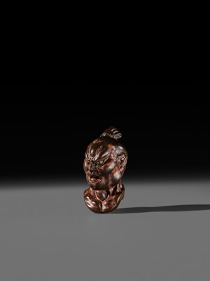 Lot 297 - A LARGE AND SUPERB LACQUERED AND CARVED HINOKI WOOD NETSUKE OF A NIO HEAD, ATTRIBUTED TO NAITO KOSEKI