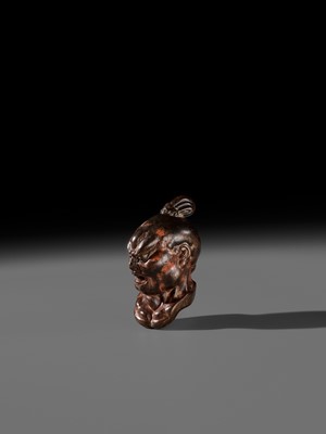 Lot 297 - A LARGE AND SUPERB LACQUERED AND CARVED HINOKI WOOD NETSUKE OF A NIO HEAD, ATTRIBUTED TO NAITO KOSEKI