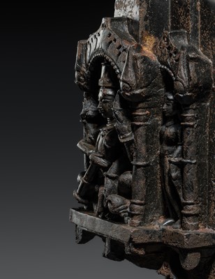 Lot 615 - A BLACK STONE ARCH SHRINE OF VISHNU AND CONSORTS, RAJASTHAN, 12TH-13TH CENTURY