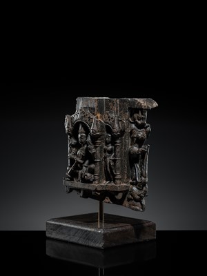 Lot 615 - A BLACK STONE ARCH SHRINE OF VISHNU AND CONSORTS, RAJASTHAN, 12TH-13TH CENTURY