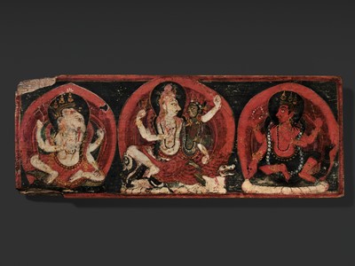 Lot 283 - A GILT AND PAINTED WOOD MANUSCRIPT COVER DEPICTING UMAMAHESHVARA, NEPAL, CIRCA 17TH CENTURY
