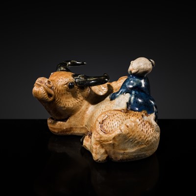 Lot 246 - A RARE BISCUIT-GLAZED ‘BUFFALO AND BOY’ WATER DROPPER, QING DYNASTY, 18TH CENTURY