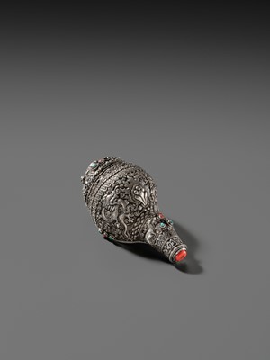 Lot 3 - A SILVER, CORAL AND TURQUOISE CEREMONIAL CONCH SHELL TRUMPET, DUNG-DKAR, 19TH CENTURY
