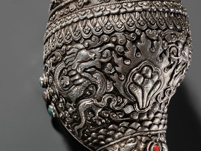 Lot 3 - A SILVER, CORAL AND TURQUOISE CEREMONIAL CONCH SHELL TRUMPET, DUNG-DKAR, 19TH CENTURY